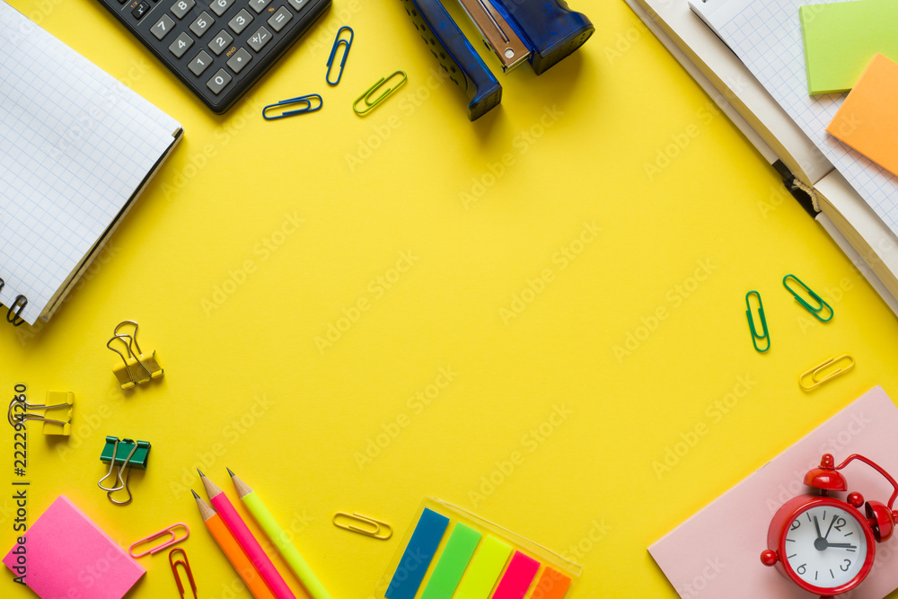 Office supplies on yellow table with copy space. Education concept, school and office. Office supplies on yellow table with copy space. Education concept, school and office.