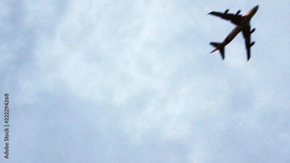View of Airplane while taking off into the sky (view from the ground can see plane's belly) View of Airplane while taking off into the sky (view from the ground can see plane's belly)