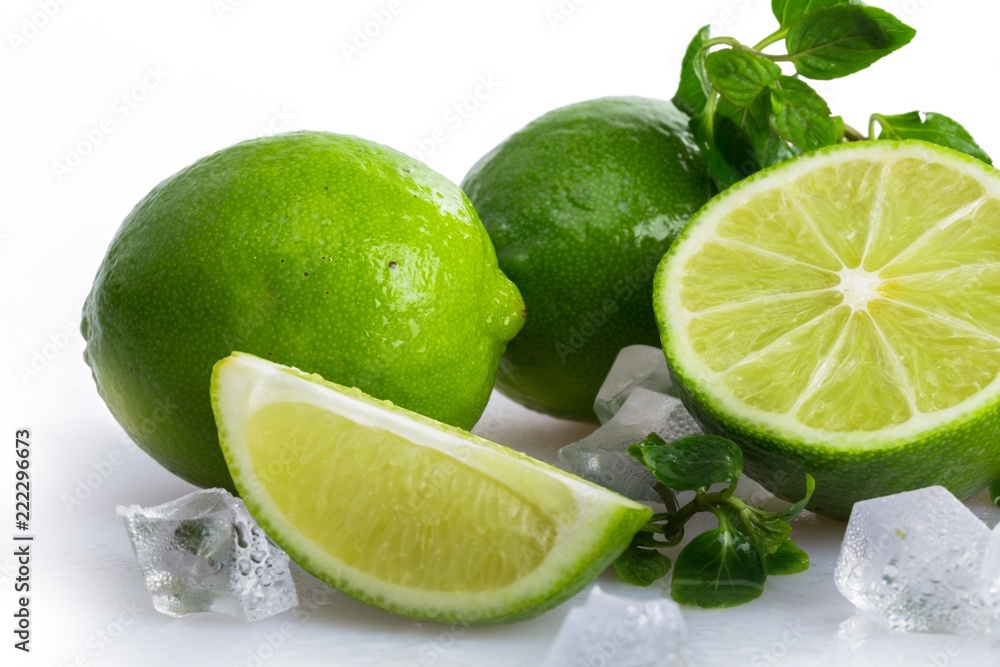 Fresh Leaves of Mint with Limes and Ice Cubes Fresh Leaves of Mint with Limes and Ice Cubes