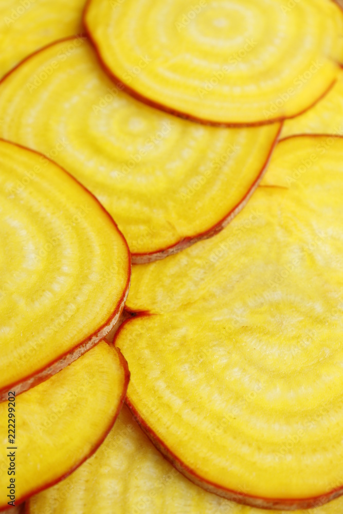 Beets are yellow slices. Vertical shot.
Beets are yellow slices. Vertical shot.