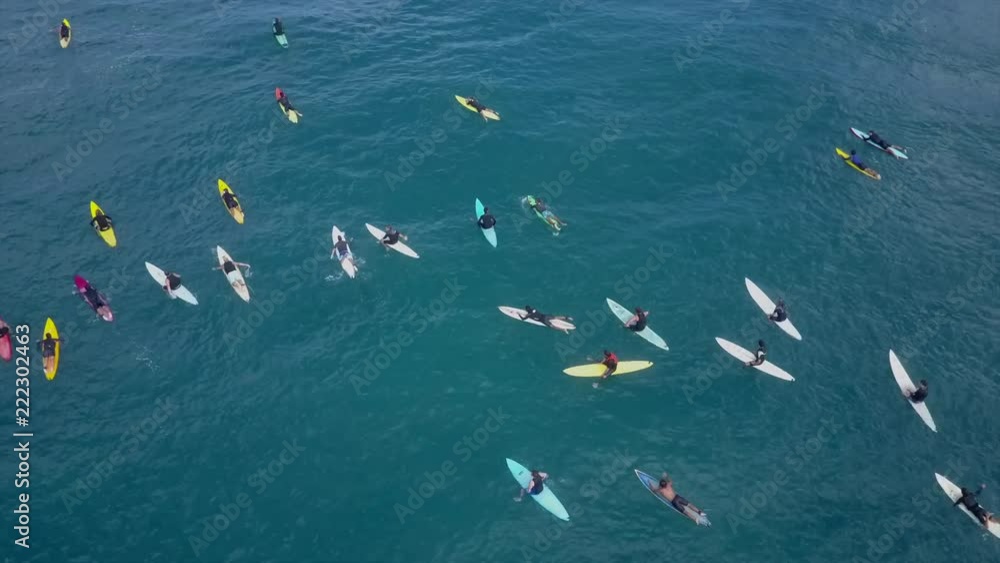Group of big waves surfers from above. line up with Colourful surfboards Group of big waves surfers from above. line up with Colourful surfboards