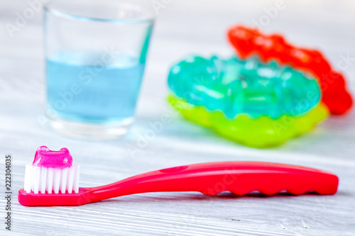 children s toothbrush oral care on wooden background