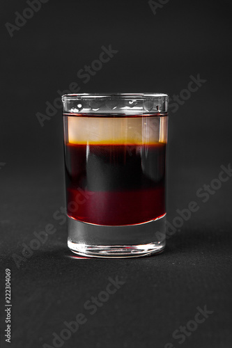 Shot of cocktail isolated black
