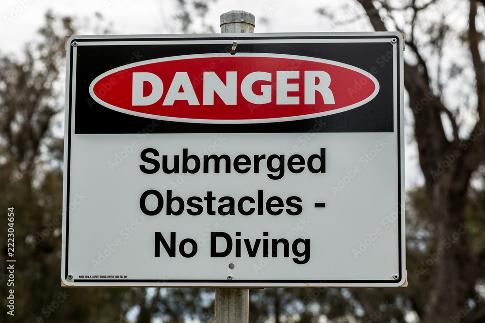 Fototapeta premium Submerged Obstacles No Diving Sign