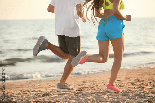 Sporty young couple running...