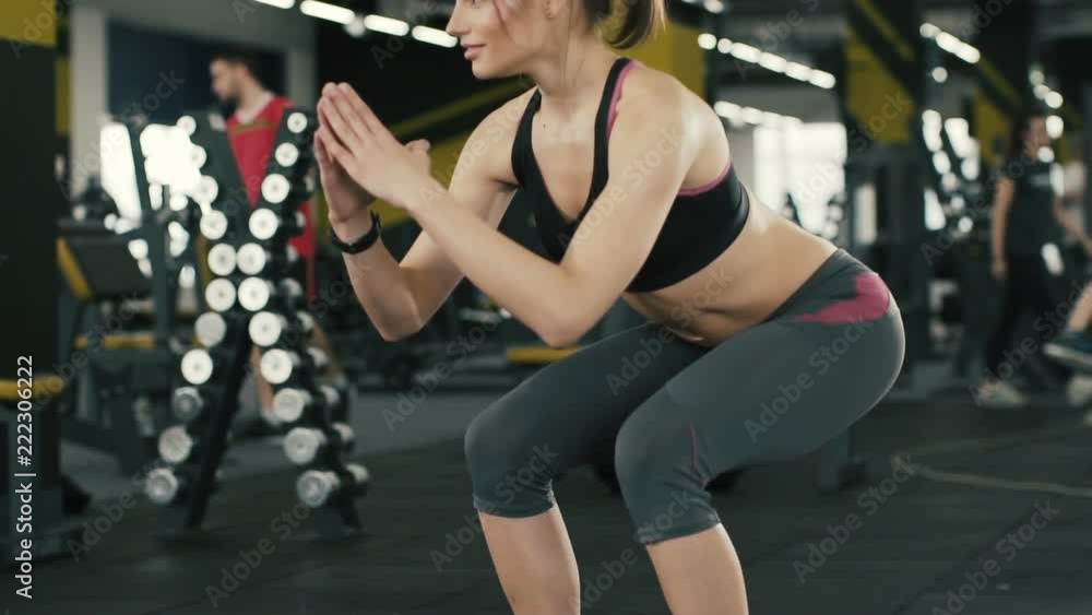 Cute girl doing exercises at gym bacground Cute girl doing exercises at gym bacground