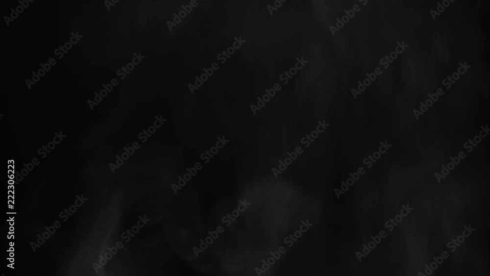 Steam and particles fly on a black background Steam and particles fly on a black background