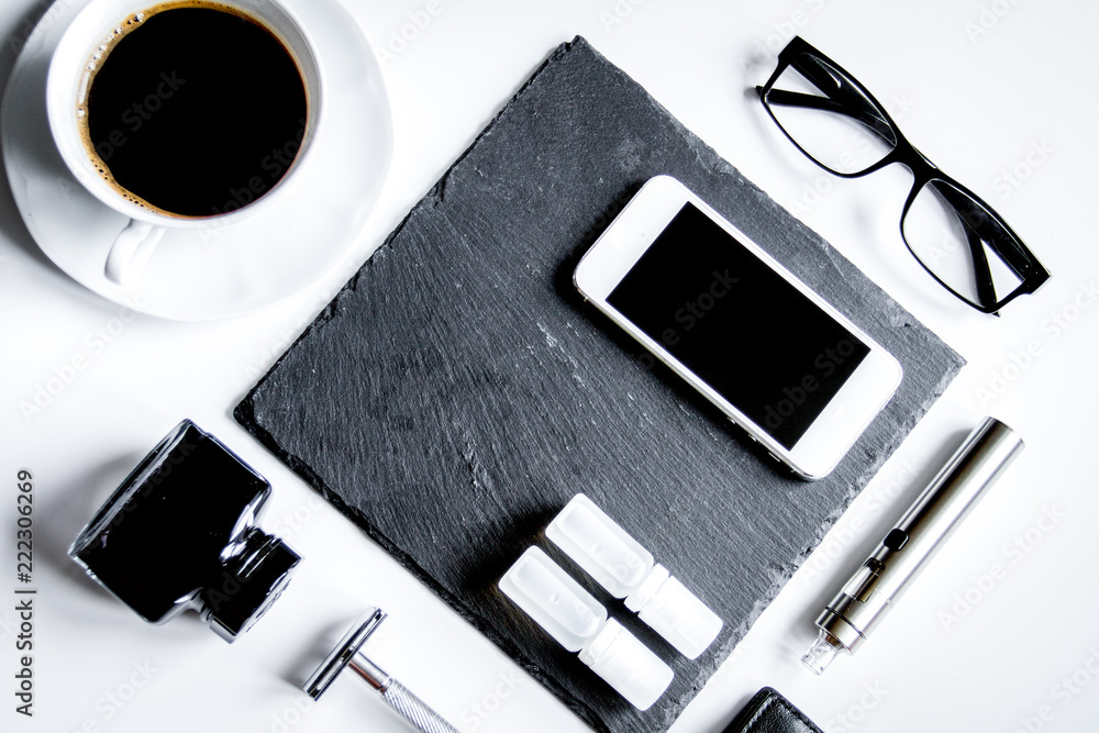 smartphone, electronic cigarette and men's accessories top view smartphone, electronic cigarette and men's accessories top view