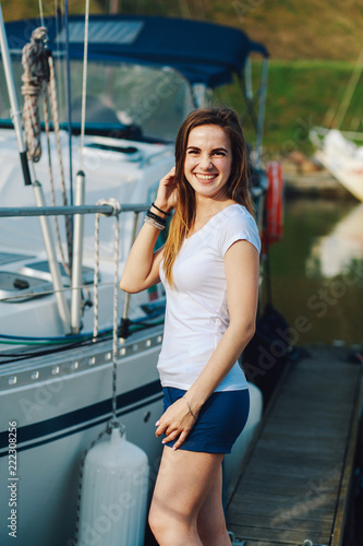 portrait of a girl against the background of a yacht club