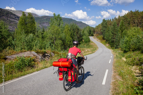 Traveling cyclist on cycle route in Southern Norway