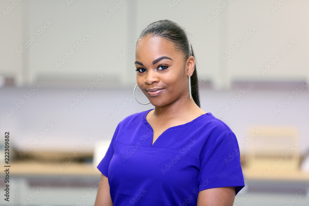 Young attractive African American female healthcare professional. Nurse in a medical clinic. Young attractive African American female healthcare professional. Nurse in a medical clinic.