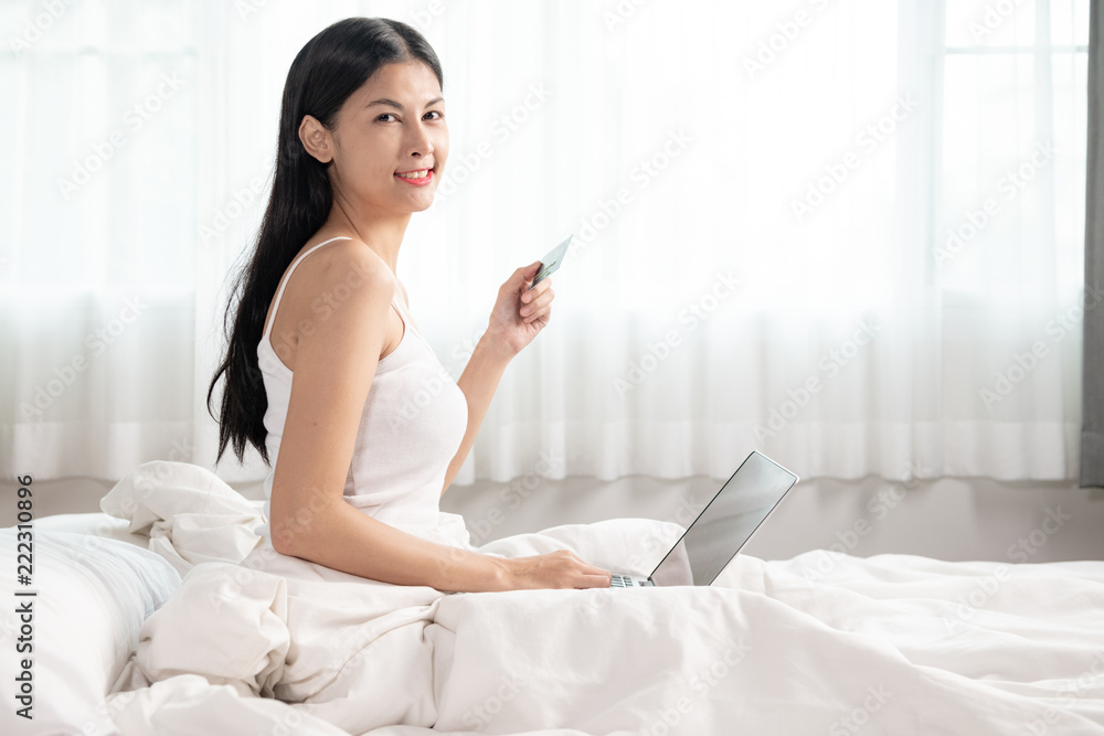 Woman shopping in bed. Woman shopping in bed.