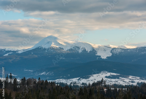 Evening winter cloudy day mountain ridge