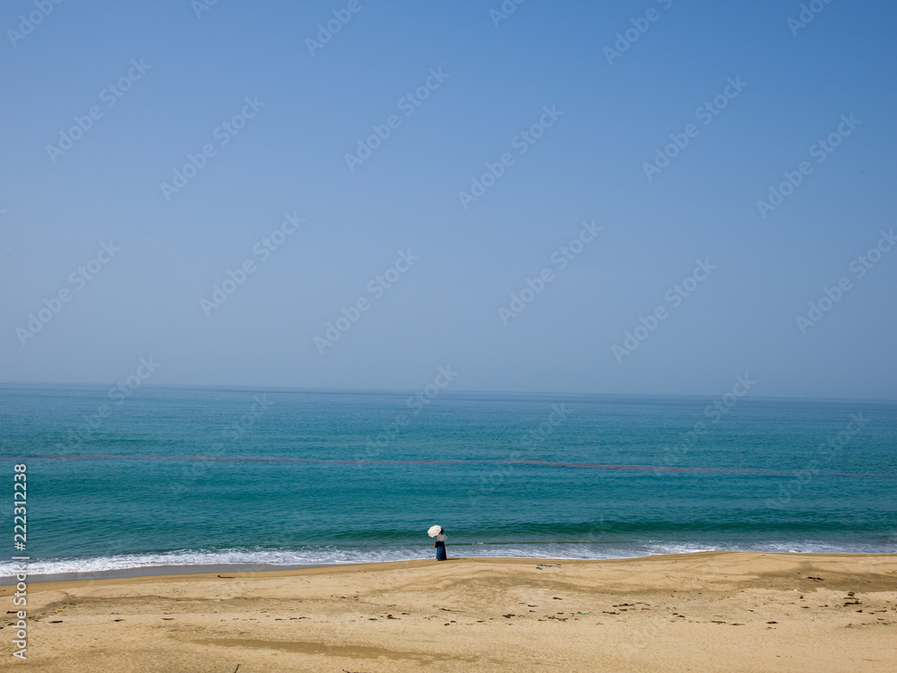 A woman looking at the sea