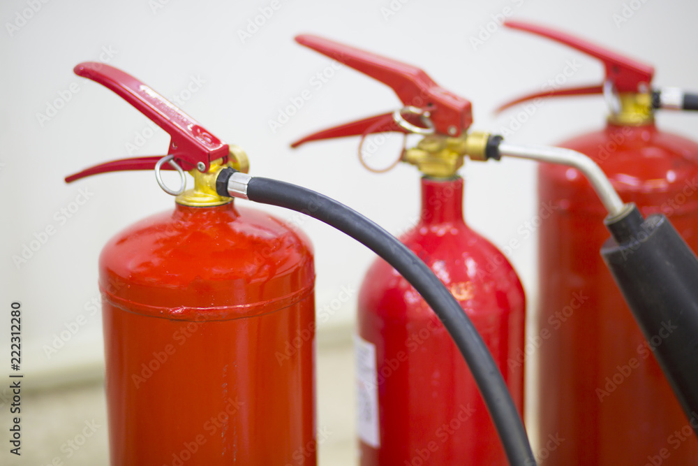 Naklejka premium fire extinguishers close up isolated on white background