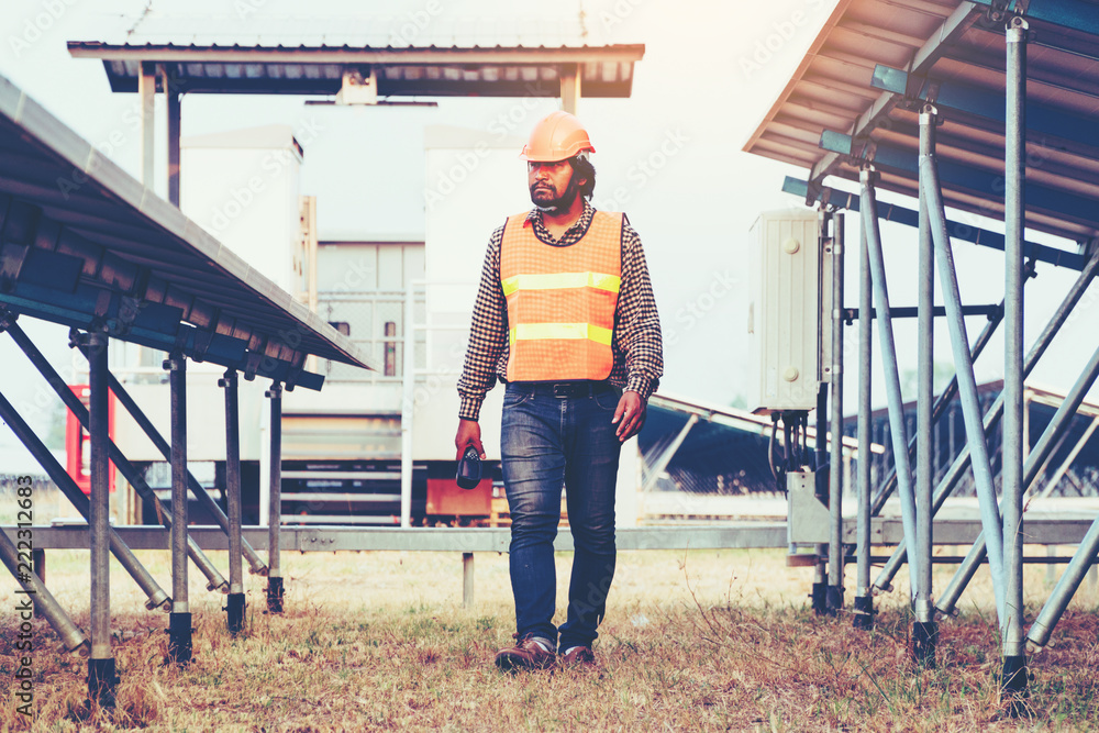 engineer working on checking equipment in solar power plant engineer working on checking equipment in solar power plant