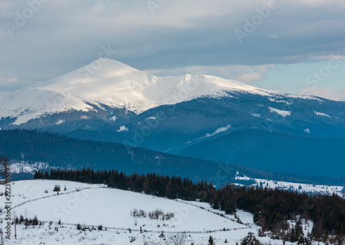 Evening winter cloudy day mountain ridge photo