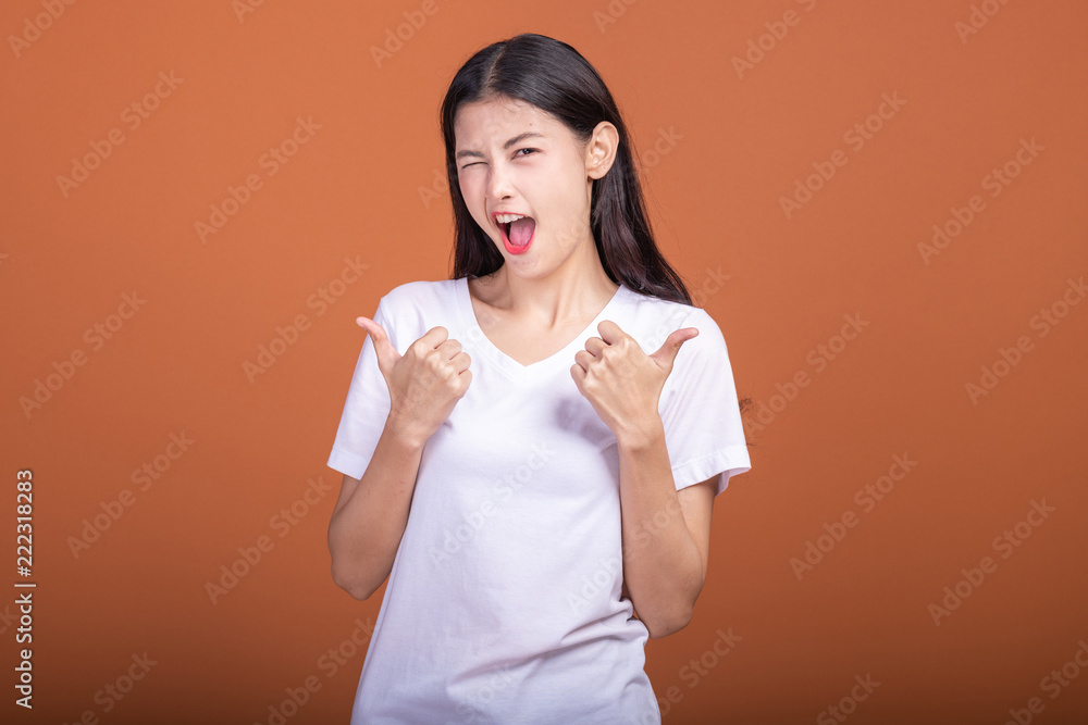 Winning woman isolated over orange background. Winning woman isolated over orange background.