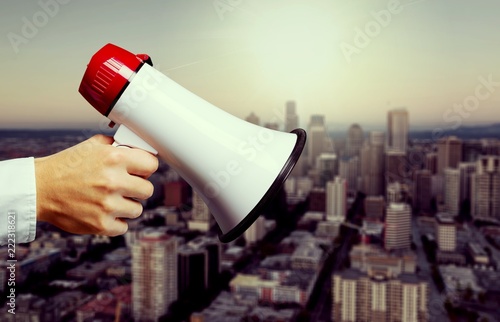 Human Hand with Megaphone on background