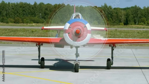 Medium shot of an old aircraft with turning propeller located at airport. 4K photo