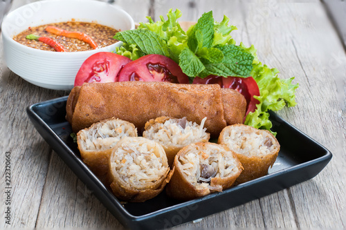 spring roll food in black dish