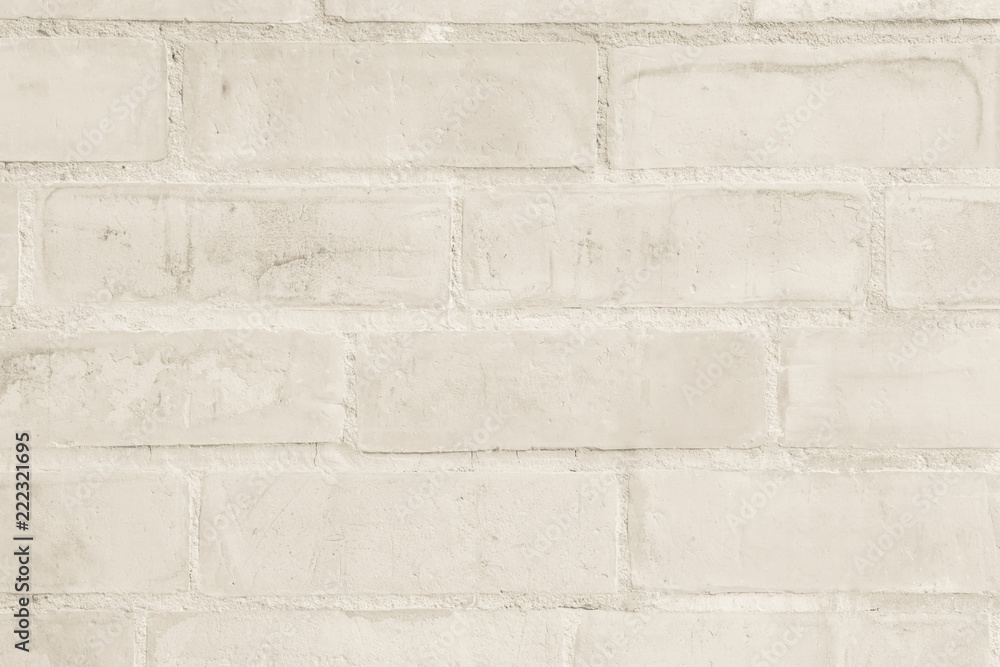 Cream and white brick wall texture background. Brickwork or stonework flooring interior rock old pattern clean concrete grid uneven bricks design stack. Cream and white brick wall texture background. Brickwork or stonework flooring interior rock old pattern clean concrete grid uneven bricks design stack.