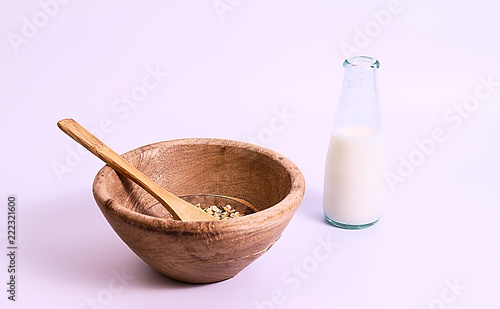Wood bowl with muesli and milk