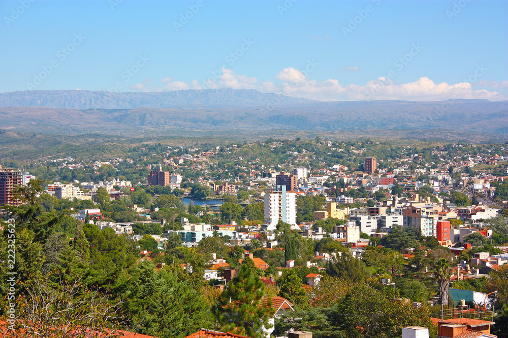VILLA CARLOS PAZ, CORDOBA, ARGENTINA - APRIL 11, 2009: Panoramic view from the top of a hill of the landscape of Carlos Paz Town in a sunny day. 