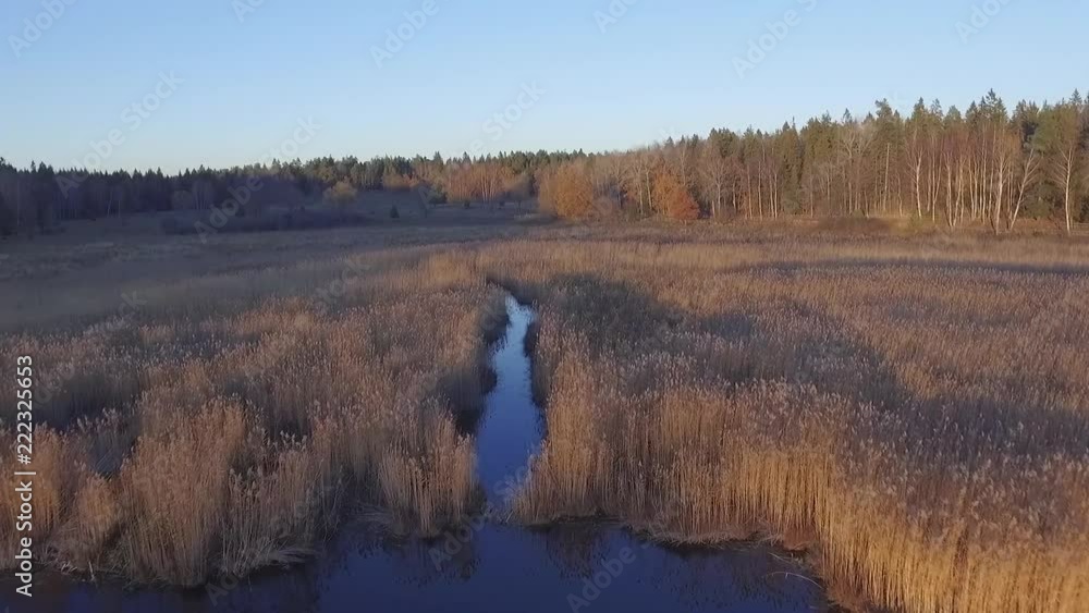 Beautiful drone flight over lake and river. Autumn/fall sunset atmosphere light Beautiful drone flight over lake and river. Autumn/fall sunset atmosphere light