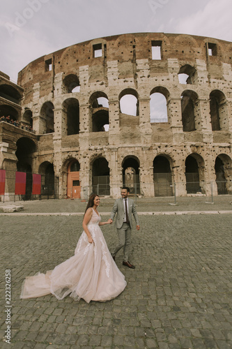 Wedding couple near  Coloss...