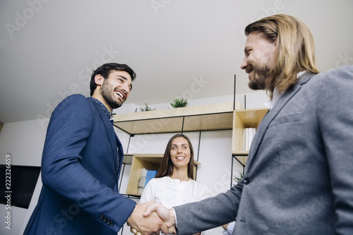 Businessmen handshaking aft...