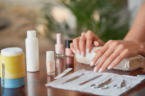 Healthy Woman Nails In Beauty Salon. Closeup Of Beautiful Female Hands. Professional tools..