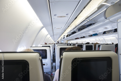 Airplane with passengers on seats waiting for take off.    