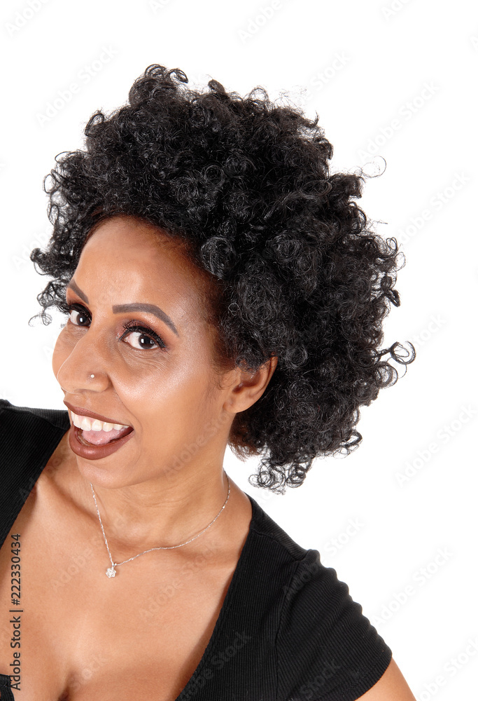 Happy young woman with fussy black hair