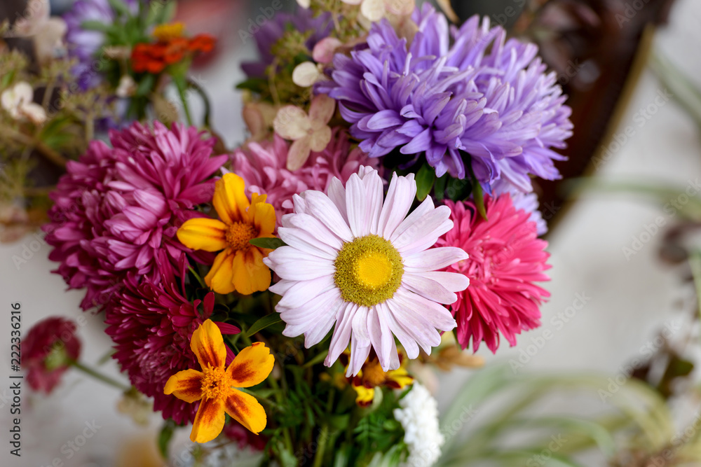 Autumn flowers, a bouquet of asters and marigolds. Selective focus Autumn flowers, a bouquet of asters and marigolds. Selective focus