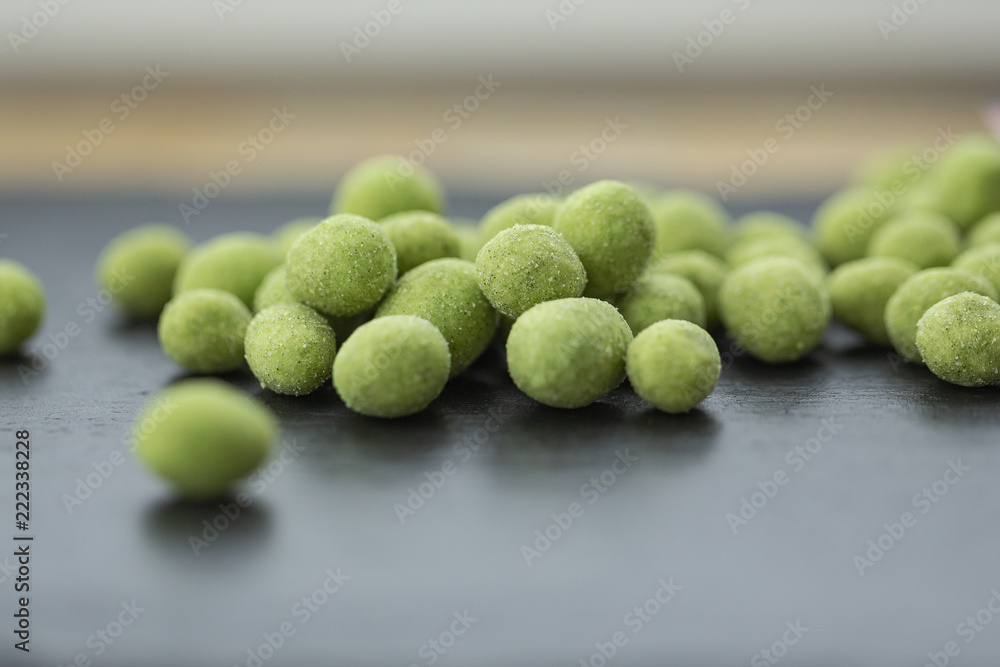 Snack, peanuts in the coating of wasabi. Close up Snack, peanuts in the coating of wasabi. Close up
