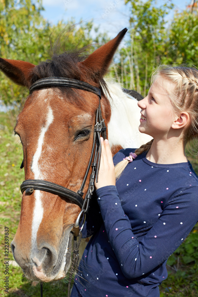 Obraz premium Portrait of young horsewoman and brown horse. Girl with horse.