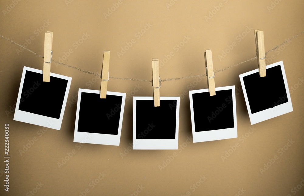 Five Blank Polaroid Frames Hanging on Twine Attached with Stock Photo |  Adobe Stock