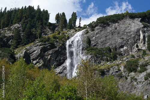 Waterfall at a pass road in Austria in early autumn 