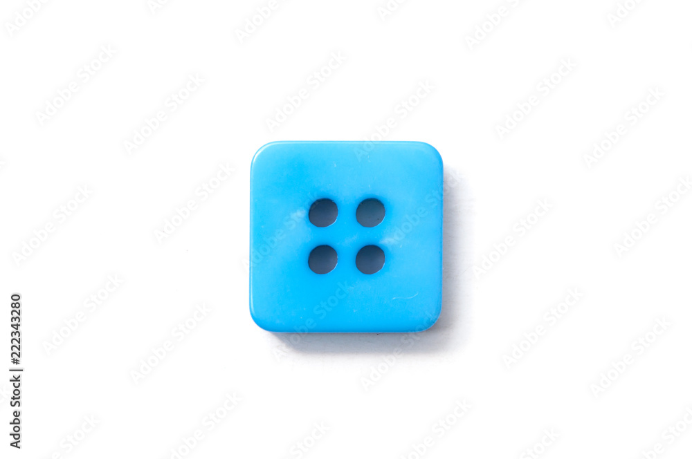 closeup of blue square sewing buttons on white background closeup of blue square sewing buttons on white background