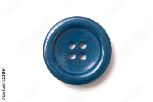 closeup of blue sewing buttons on white background