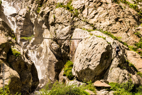 Climbing on mountains and rocks. Bridge between rocks.