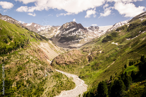 The nature between the mountain view. A dry river in the middle.