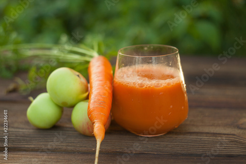 Carrot juice in glass on  table