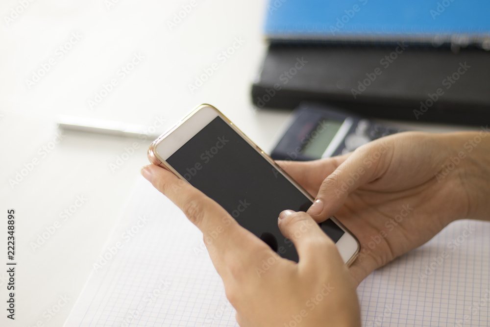 Woman using a smartphone with black screen Woman using a smartphone with black screen
