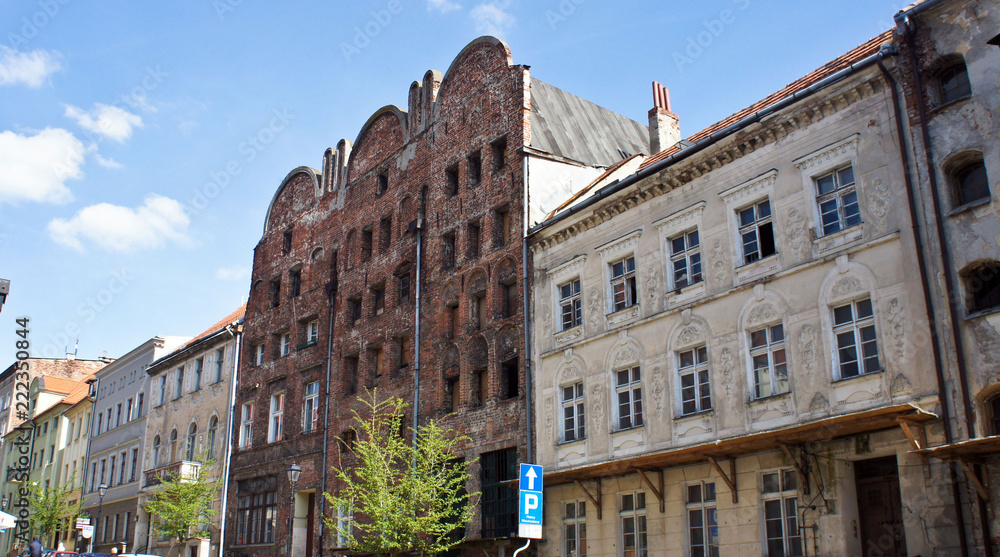 Torun, Poland, street in old town with beautiful buildings, sunny day