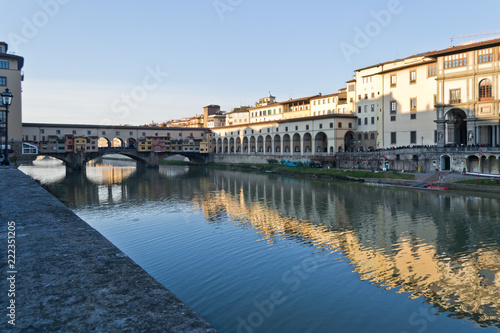 Famous bridge Ponte Vecchio over Arno river at sunset in Florence, Tuscany, Italy