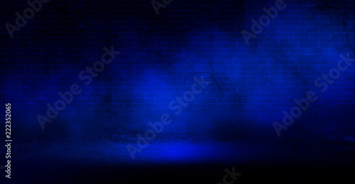 Background of an empty room with a brick wall, cracks, searchlight lights, neon light.