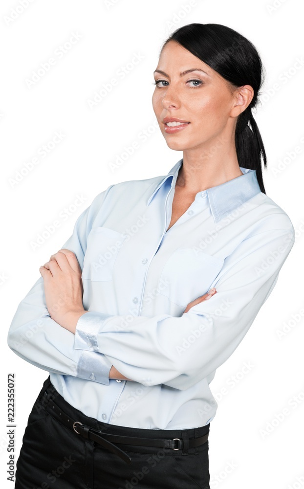 Businesswoman leaning back slightly with her arms crossed Businesswoman leaning back slightly with her arms crossed