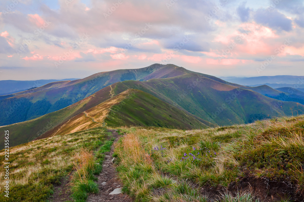 Obraz premium View of the mountain range at sunrise. Summer mountain landscape